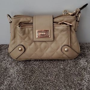Tiny compact tan purse with zippers